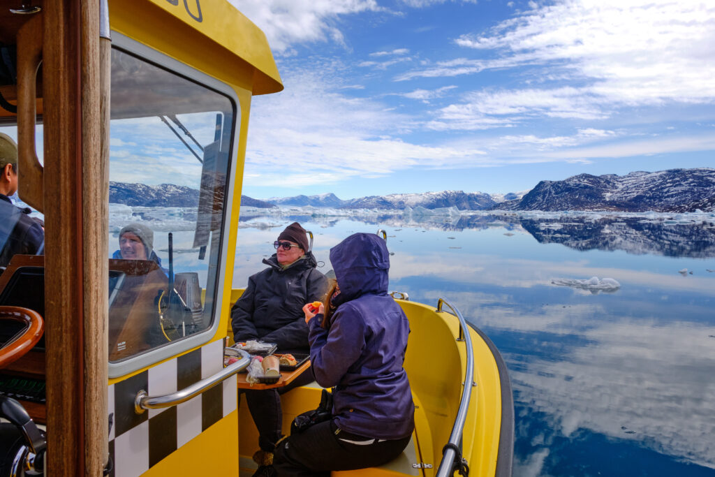 Having lunch in the front of the boat on a tour to the Nuuk Icefjord with Guide to Greenland