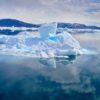 Iceberg reflected and visible beneath the water the Nuuk Icefjord on a boat tour with Guide to Greenland