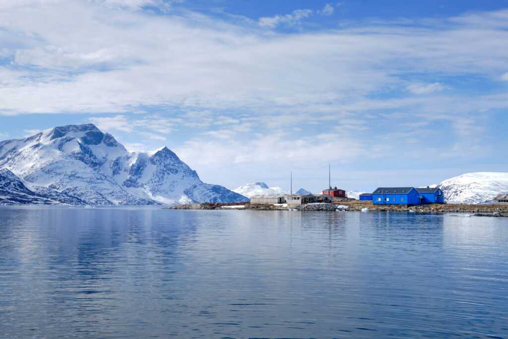 Passing the old Qoornoq fish factory on a boat tour up the Nuuk Fjord with Guide to Greenland