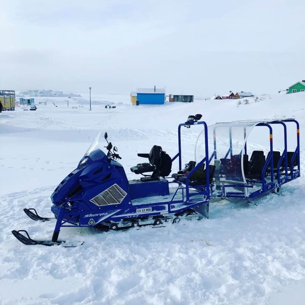 Snowmobile tour to small settlement Oqaatsut Ilulissat Guide to
