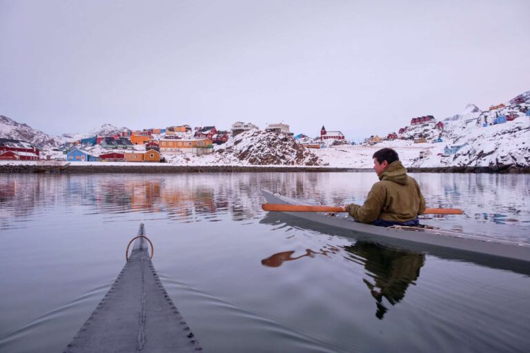 Kayaking in a traditional kayak in winter in Sisimiut - Guide to Greenland