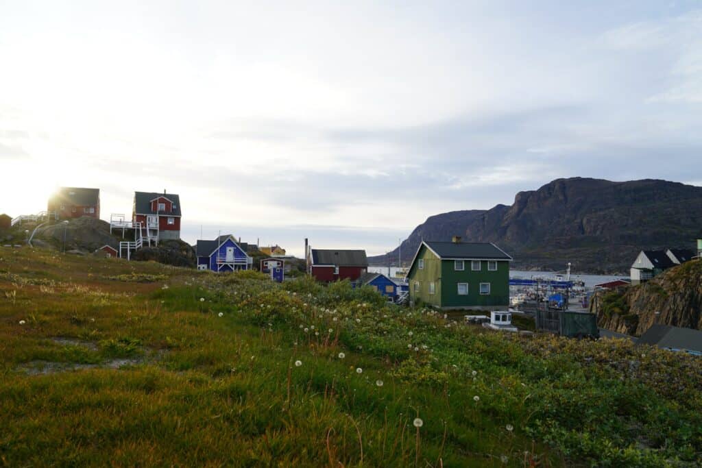 Sun shining down upon a city in Greenland