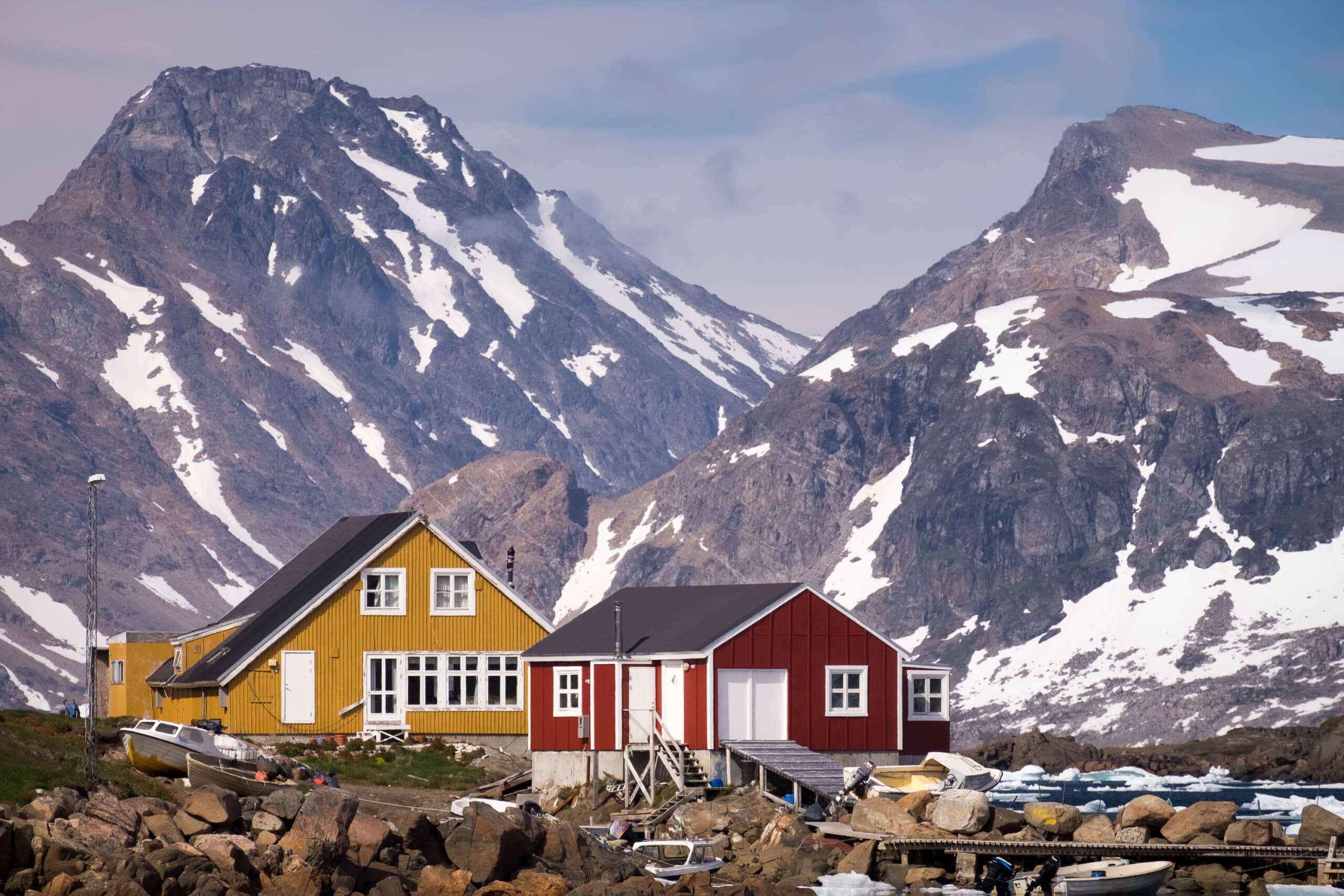 Colorful Houses In Kulusuk Set Against The Impressive Mountains Of East Greenland Summer Guide To Greenland Scaled 