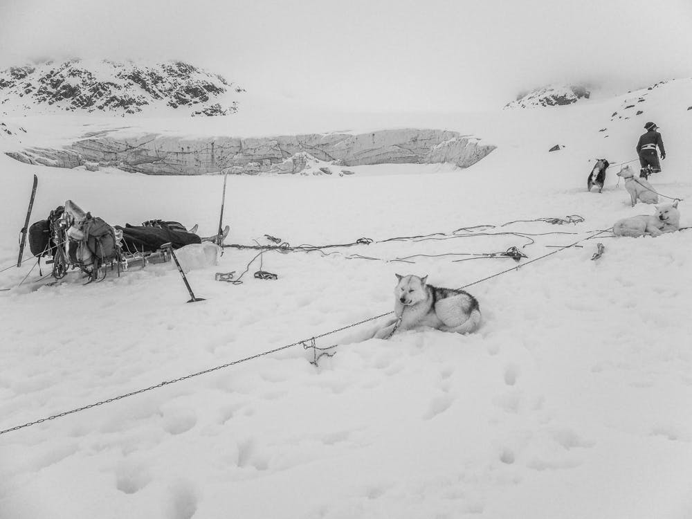 Camping on a frozen lagoon under a glacial head wall
