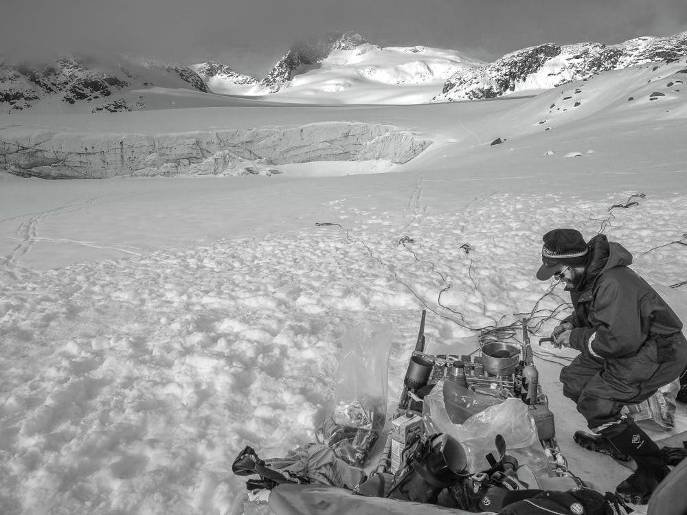 Man making dinner in the snow