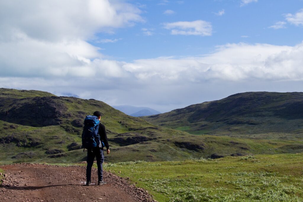Man wearing a backpack enjoying the view