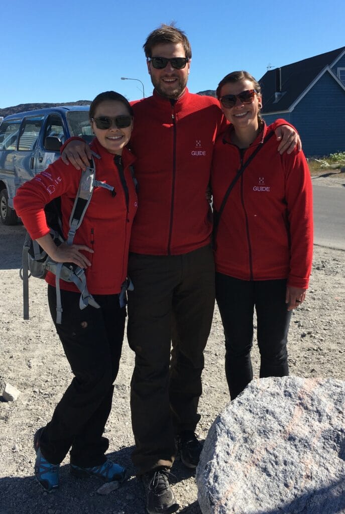 People in red, guides, shirts about to go hiking