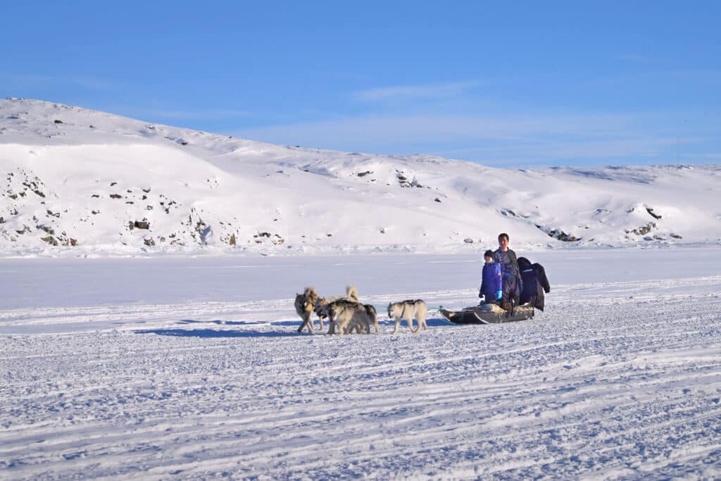 Dogsledding across the sea ice near Aasiaat