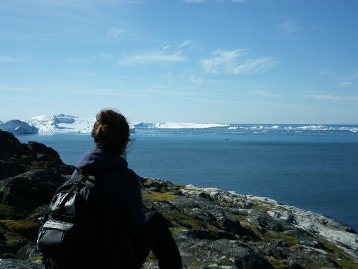 Woman enjoying the view of the fjord