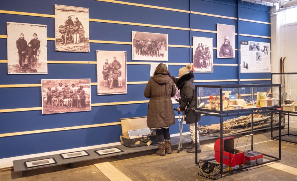 A couple looking at an exhibition inside the Nuuk Local Museum