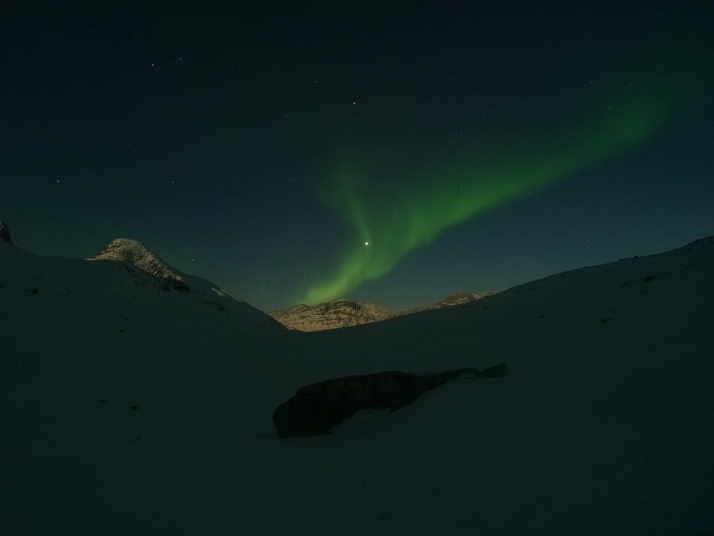 Northern lights over a mountain top