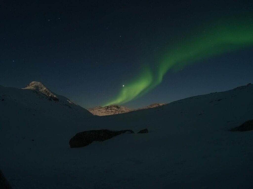Northern lights over a mountain top