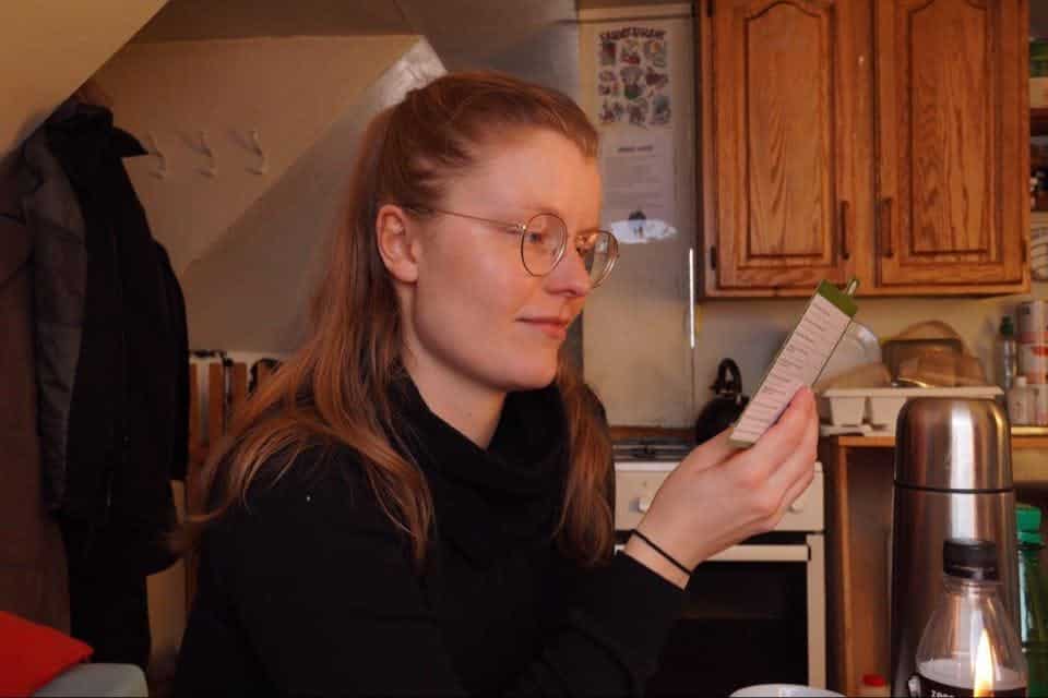 A woman reading something from a board game