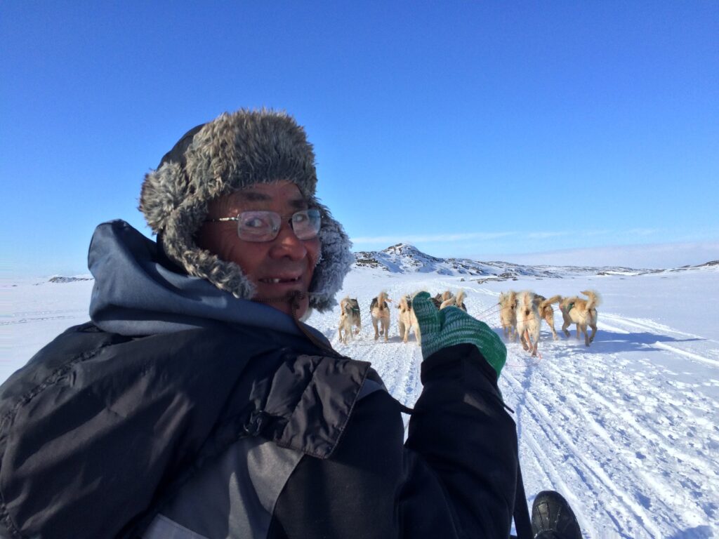 Musher on dog sled
