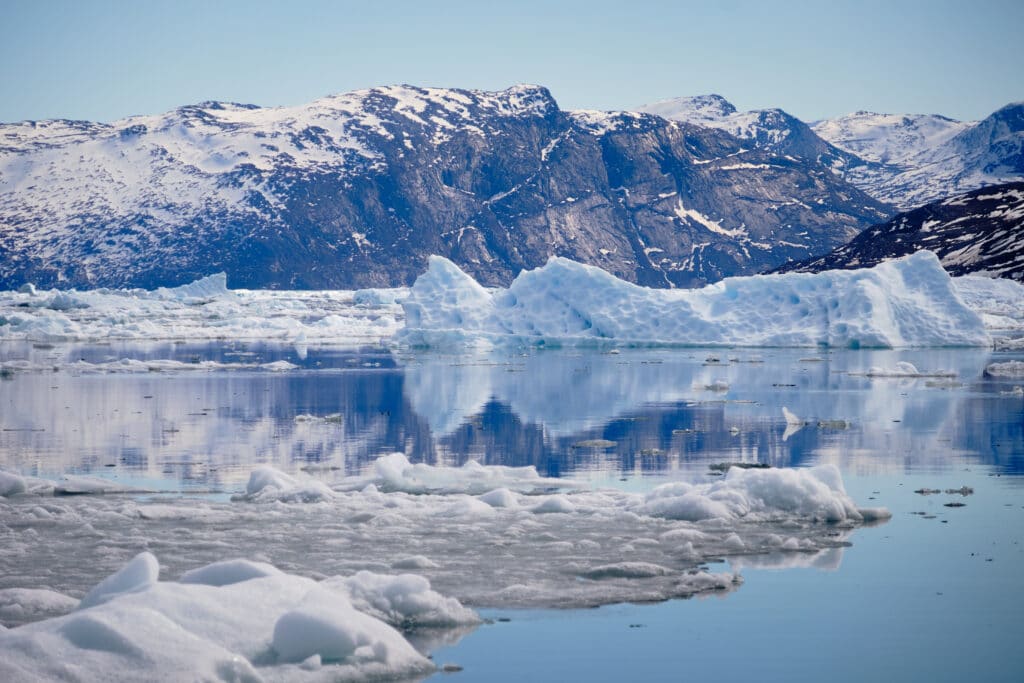 Reflections of icebergs in the water the Nuuk Icefjord on a boat tour - Guide to Greenland