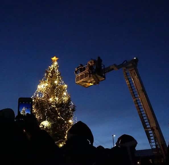 Christmas tree being lit up