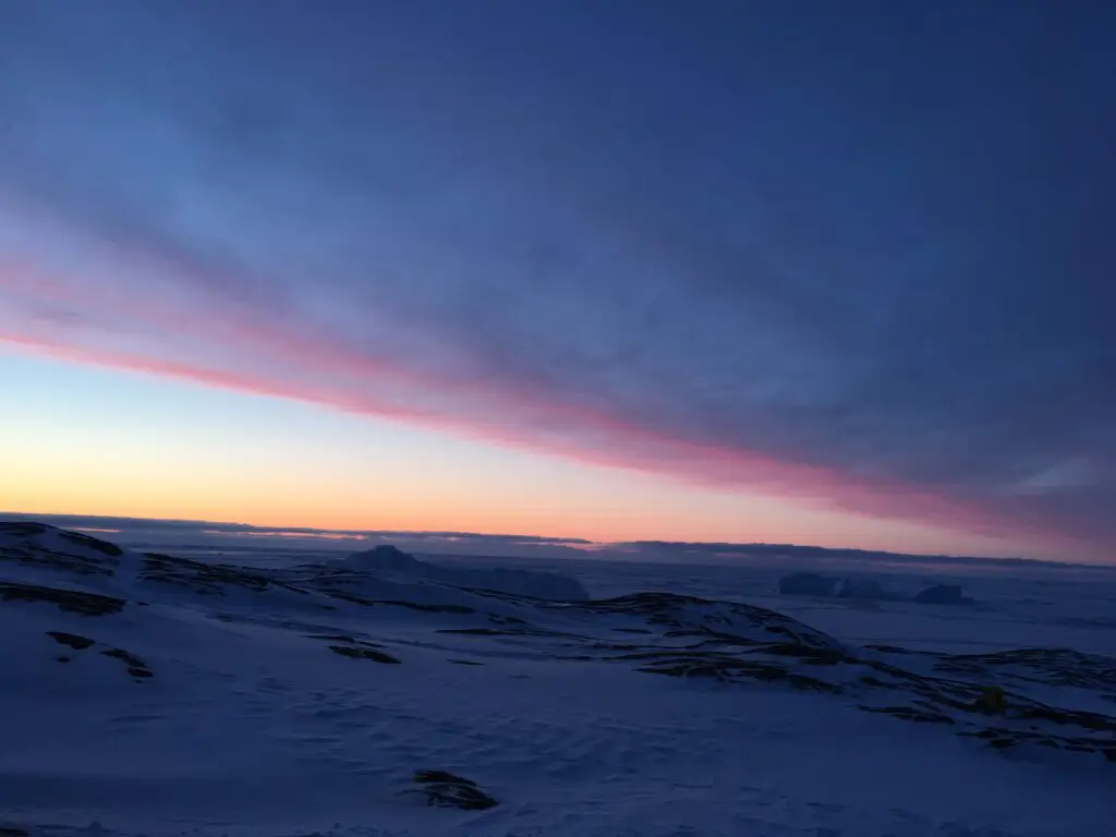 Snowshoeing with a red sky