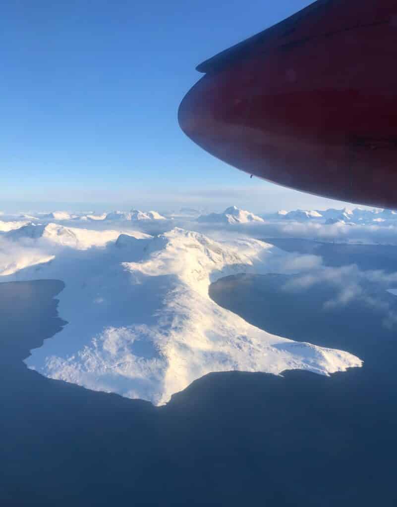 View of Greenland from above, land covered in snow