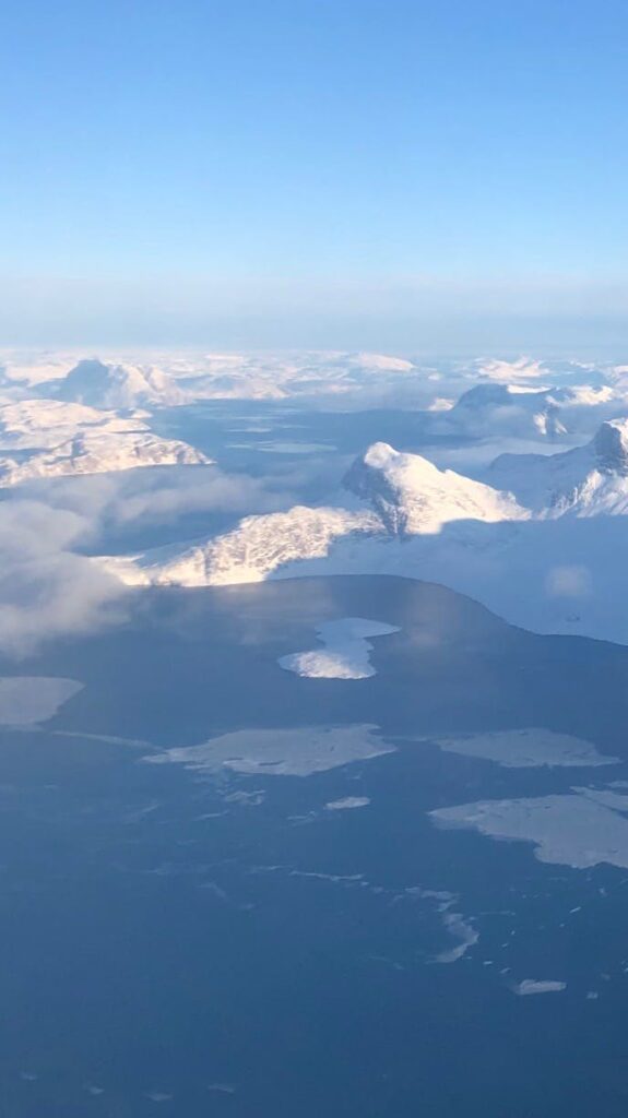 View of Greenland from above, land covered in snow