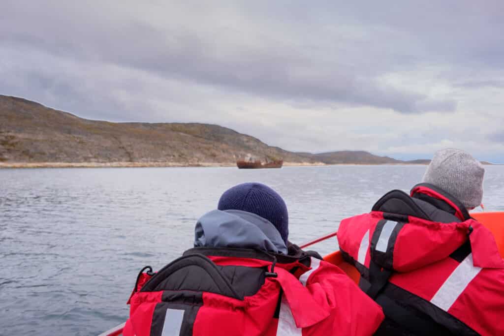 The wrecked fishing trawler is a popular destination on a boat tour from Aasiaat