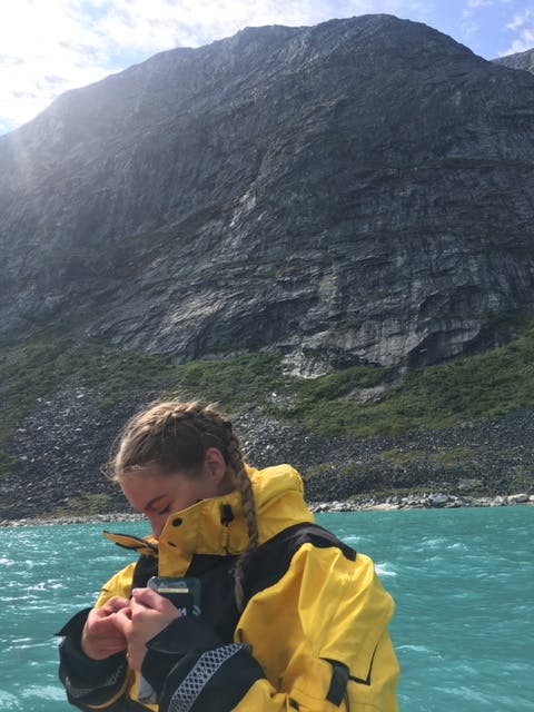 Girl paddleboarding on the icefjord