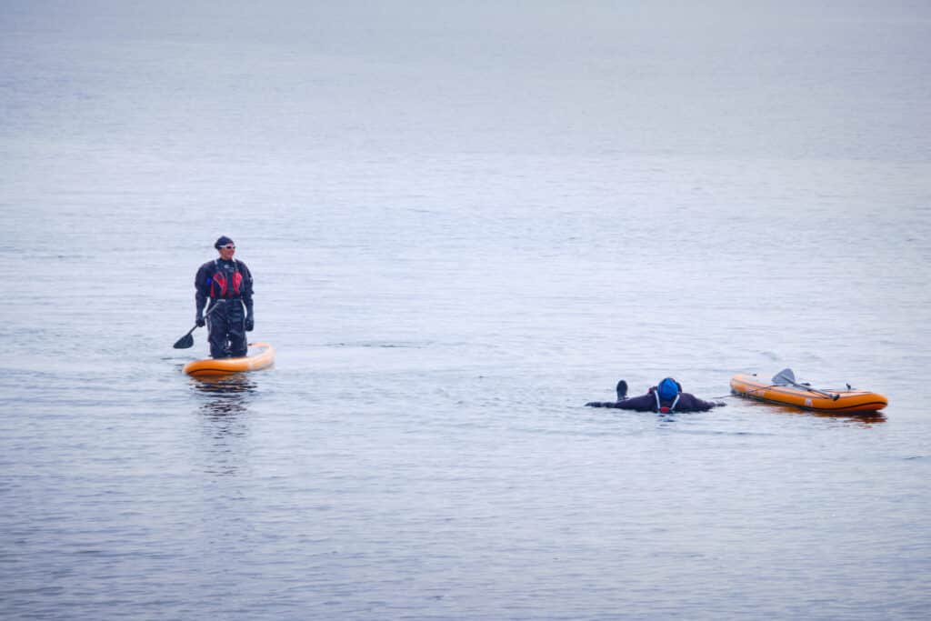 Doing a non-hard-core polar plunge while paddleboarding in Nuuk - Guide to Greenland