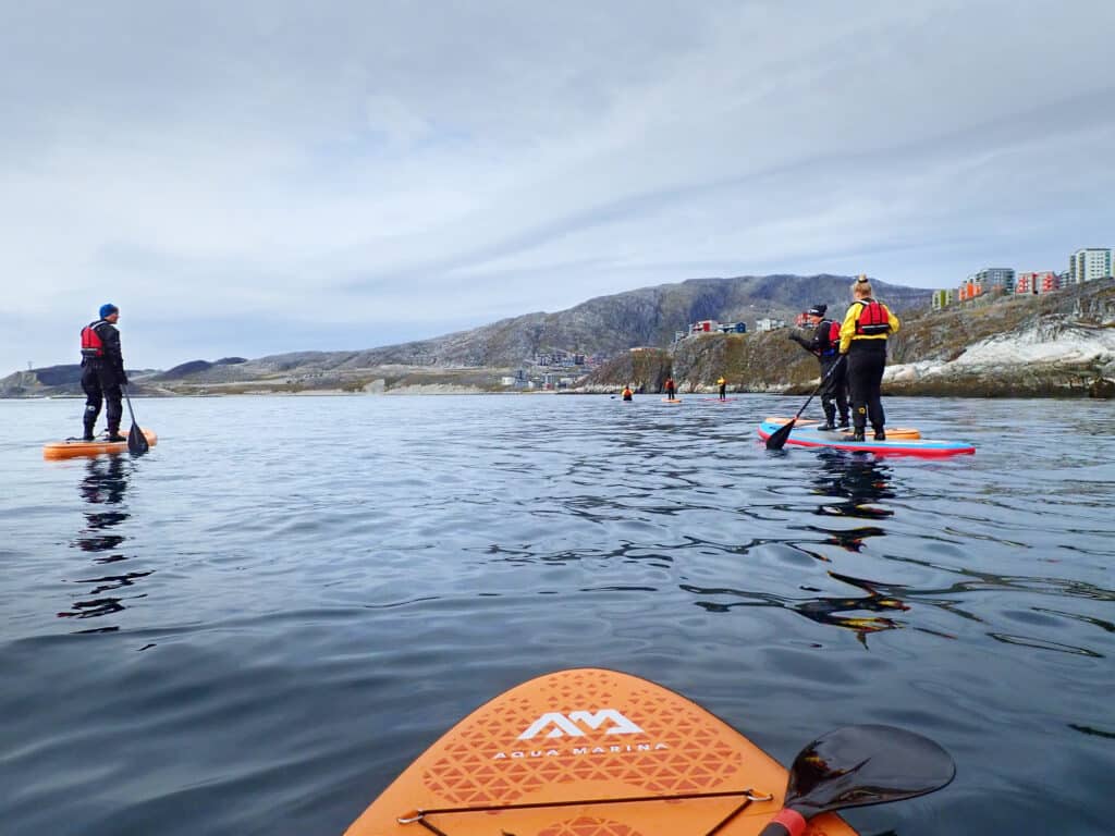 The view from a stand-up paddleboard on an introduction tour in Nuuk - Guide to Greenland