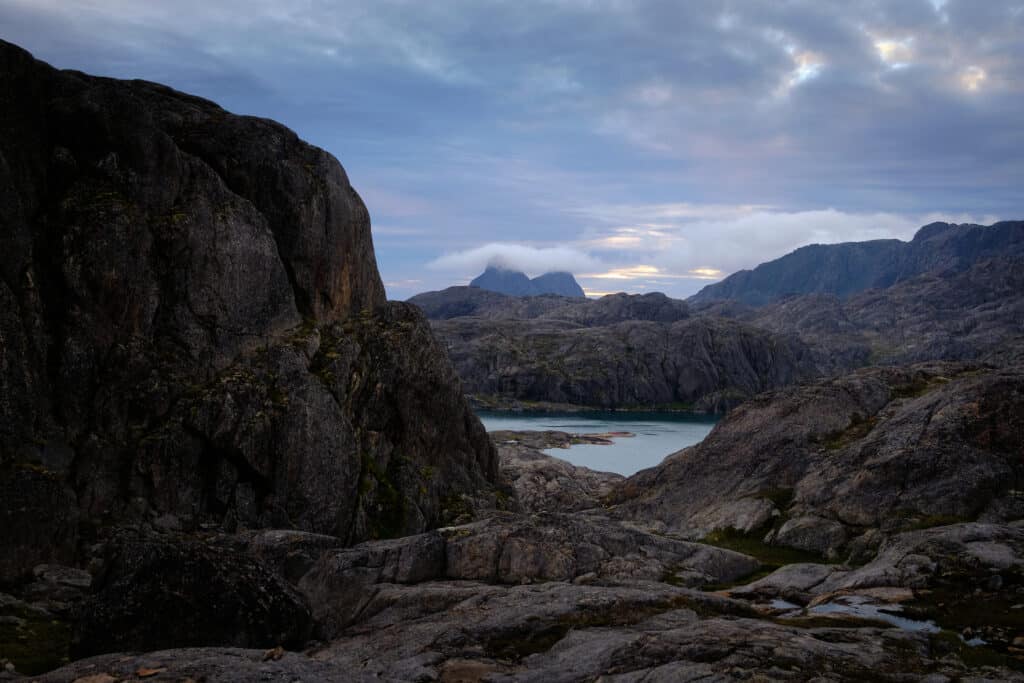 The twin peaks of Uummannarsuaq are hidden by clouds on a hiking trip near Maniitsoq - Guide to Greenland