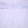 Snowmobile tracks across the frozen Kangerlusarsuk Tulleq fjord near Sisimiut