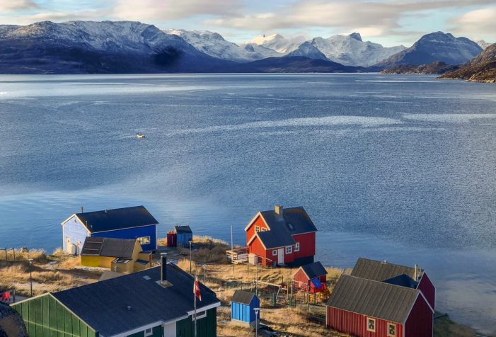 View over the colorful houses of Kapisillit – summer – guide to greenland View over the colorful houses of Kapisillit looking out into the fjord - summer - Guide to Greenland