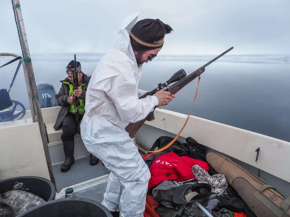 Seal hunter getting his riffle ready