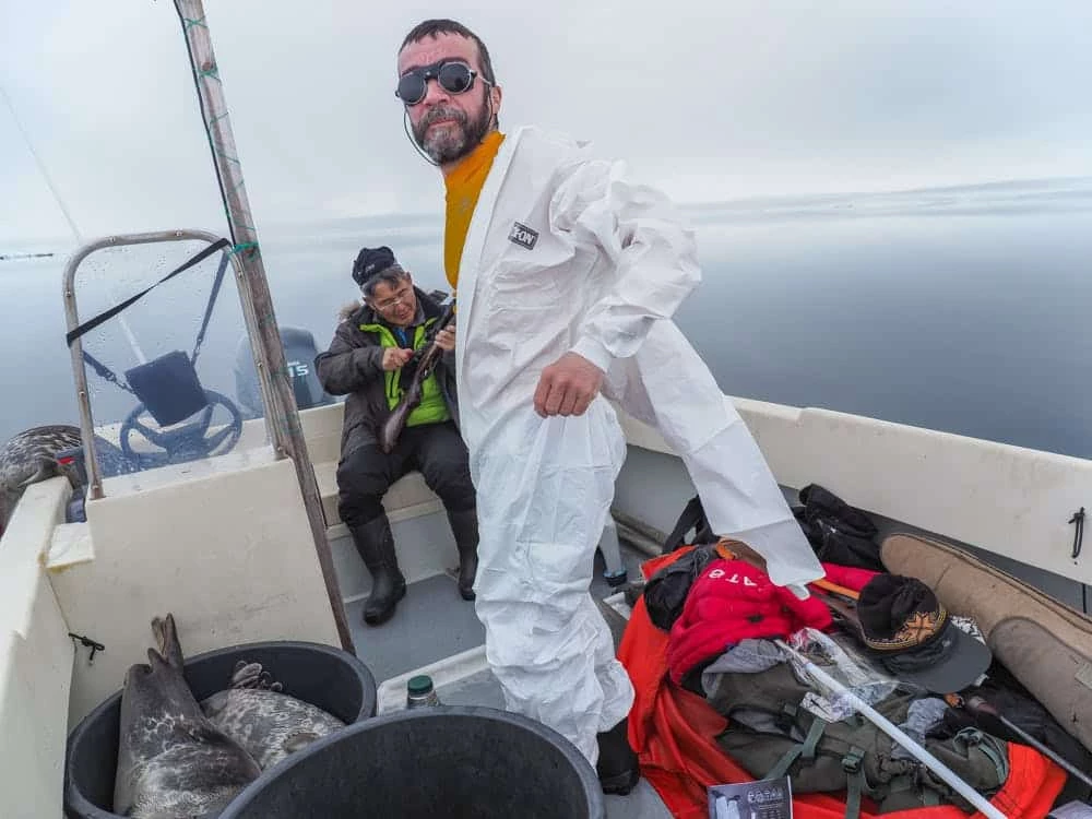 Seal hunter putting on a suit