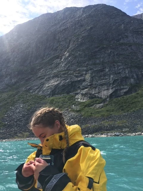 Girl paddleboarding on the icefjord